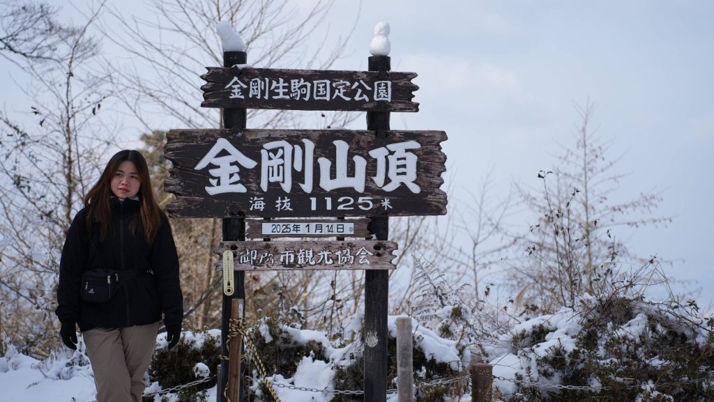 a girl on top of mt. Kongo during hiking tour from osaka by Matcha Experience Osaka