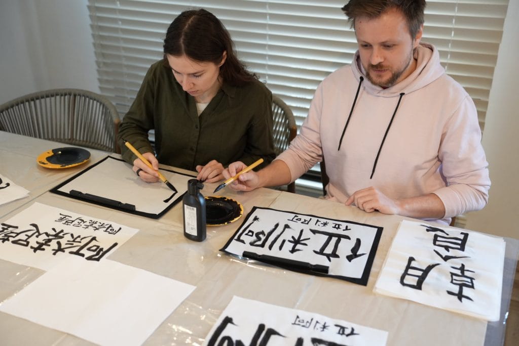 Matcha Experience Osaka calligraphy two tourist from russia
